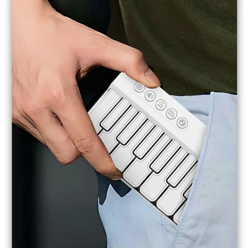 Hand slipping the pocket piano into a jeans pocket